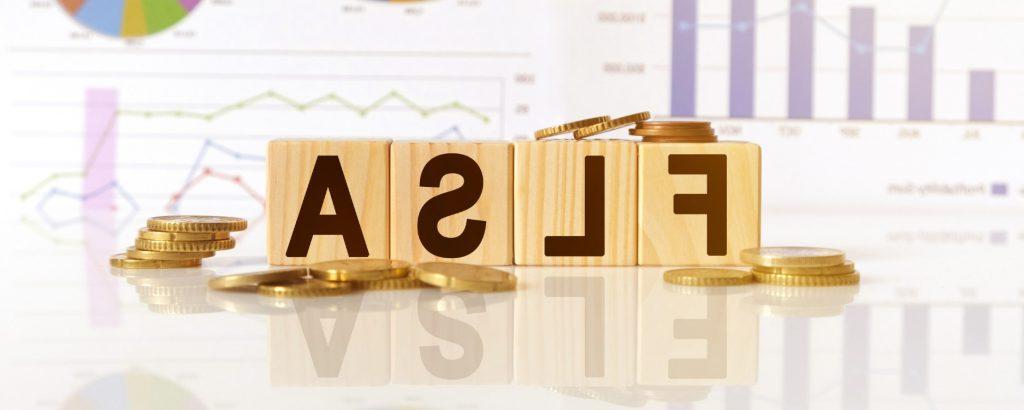 Image of wooden blocks with the letters FLSA on them